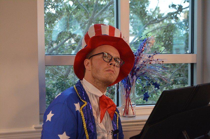 Choralmaster, Sam Nelson leads concert sing-along dressed as Uncle Sam.