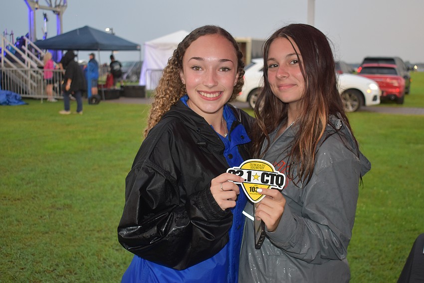 Sarasota's Addison Williams and Katelyn Livingston were waiting to hear the winner of the raffle for Brad Paisley tickets during Fireworks on the Lake at Nathan Benderson Park.