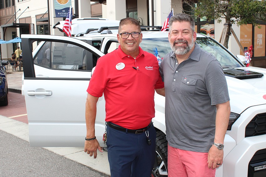 Gettel Toyota's Joe Rodriguez, a sales rep, and Rocky Santa Cruz, the general manager, were loving the Star-Spangled Spectacular, which their company sponsored.