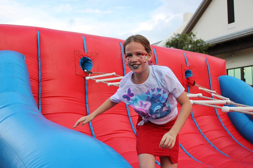 Sarasota 10-year-old Libby Bates couldn't get all the way up the twisty ladder at Star-Spangled Spectacular, but she still came up smiling.