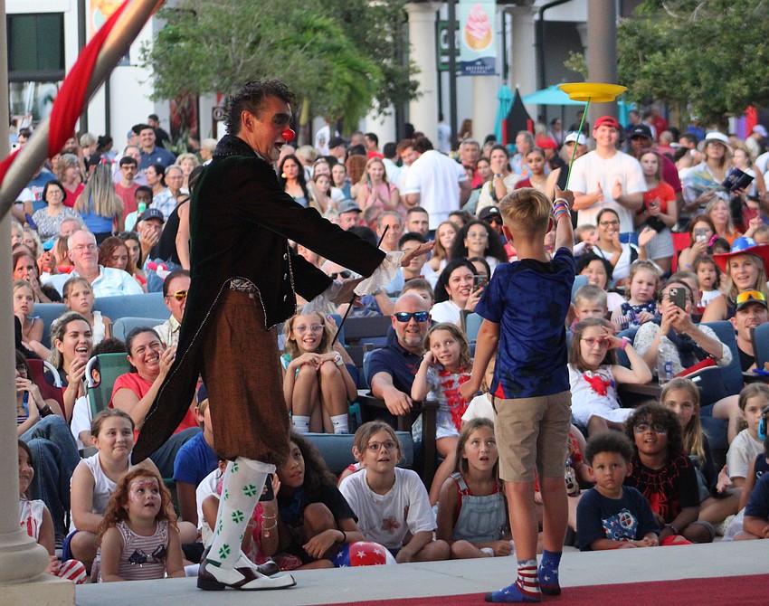 Clown Juan Carlos Valencia enlisted some help during his performance at Star-Spangled Spectacular at Waterside Place July 4.