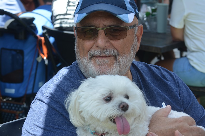 Dexter and owner Gary DiDonna are excited to celebrate Hot Dog Day at Hamlet's Eatery.