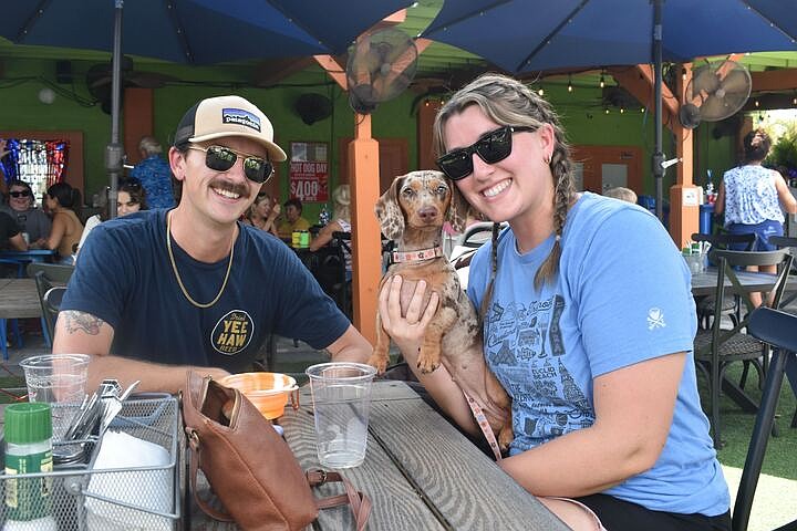 Brandon Stevens, his wife Emily Lafferty, and their dog Opal.