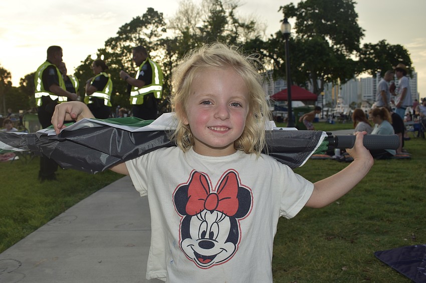 Hazel Schlotke, 4, stands prepared, with an umbrella.