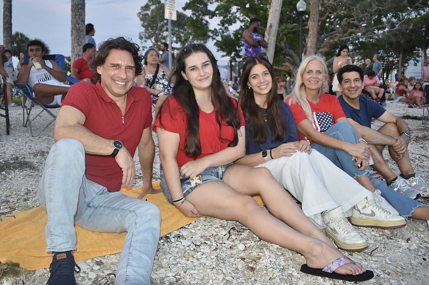Bradley Pace, his daughter Mackenzie Pace,  along with Olivia Pace, her mother Jenny Pace, and her father and Bradley's brother Adrian Pace, found a seat by the shoreline to watch the fireworks.