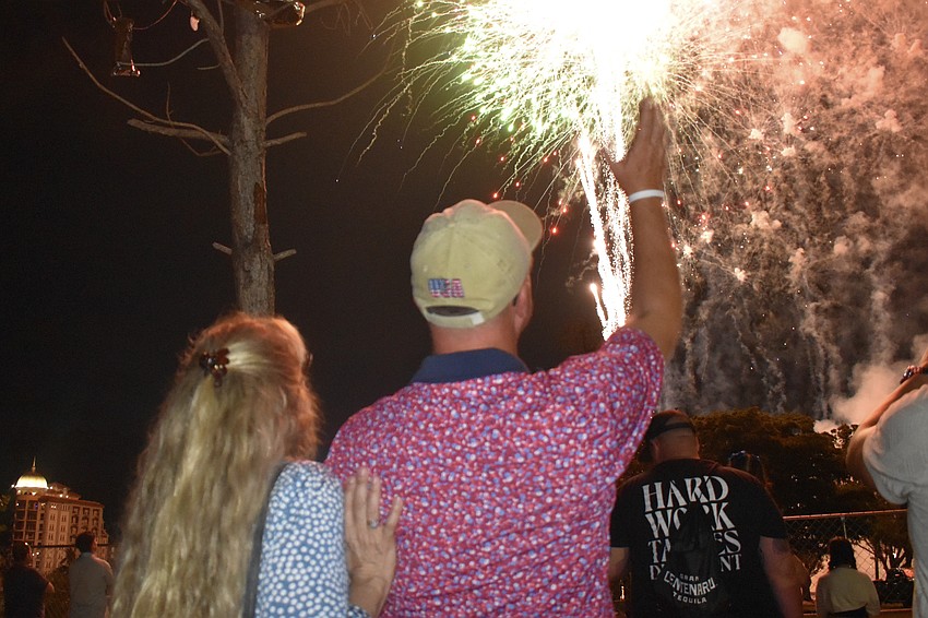 Stephen Schlabach and his wife Jennifer Schlabach watch the grand finale of the fireworks.