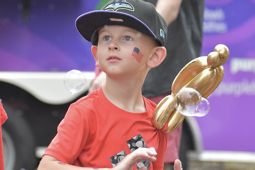 Isaac Satriano, 6, plays in the bubbles.