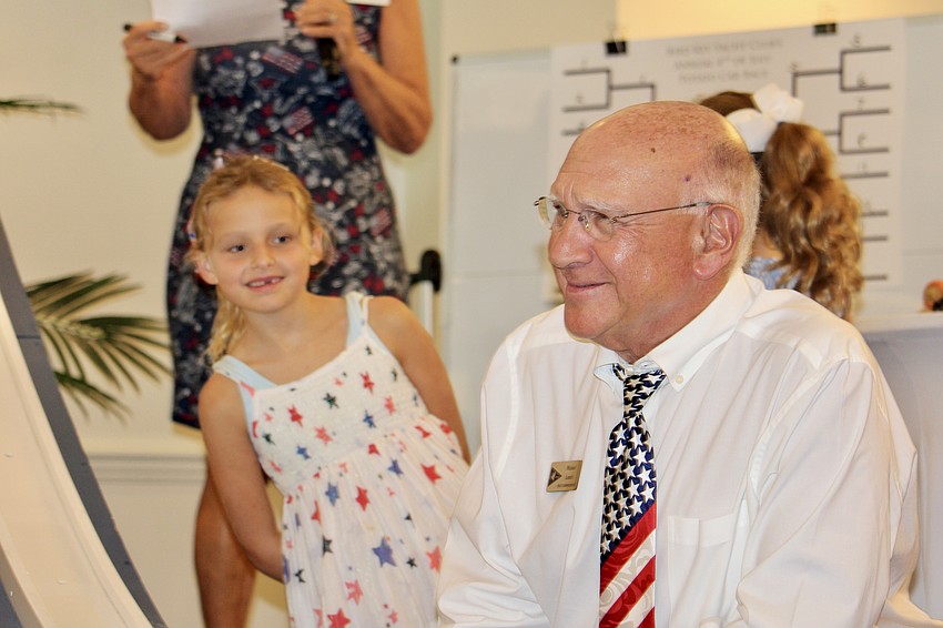 Former Bird Key Yacht Club Commodore Michael Landis smiles next to the potato races track.