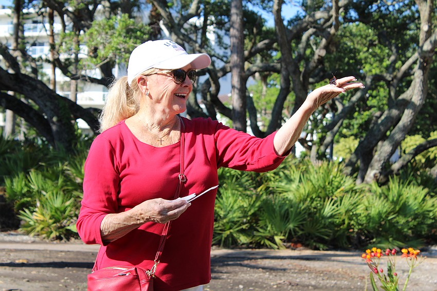 Phyllis Black releases a butterfly at Bicentennial Park on July 5.