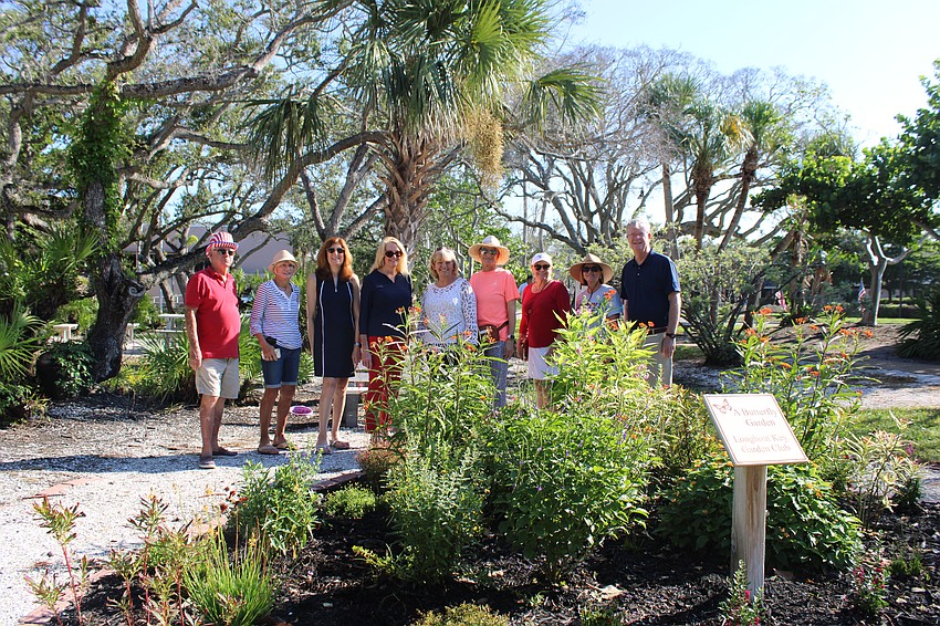 Longboat Key Garden Club members celebrated their hard work restoring Bicentennial Park, especially the butterfly garden. From left, Jim Brown, Joyce Welch, Denise Schwemmer, Susan Phillips, Melanie Dale, Bobbie Goldwater, Phyllis Black, Kelly Shrout and Steve Branham.