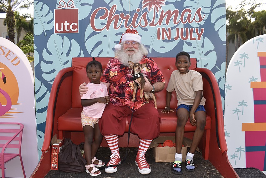 Jhaynih Badio, 2, and Jayden Badio, 10, are visiting from Boston with their dog Shilo.