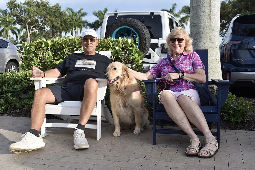 Braden Woods David and Linda Foxlow sit with their 3-year-old golden retriever Macy.