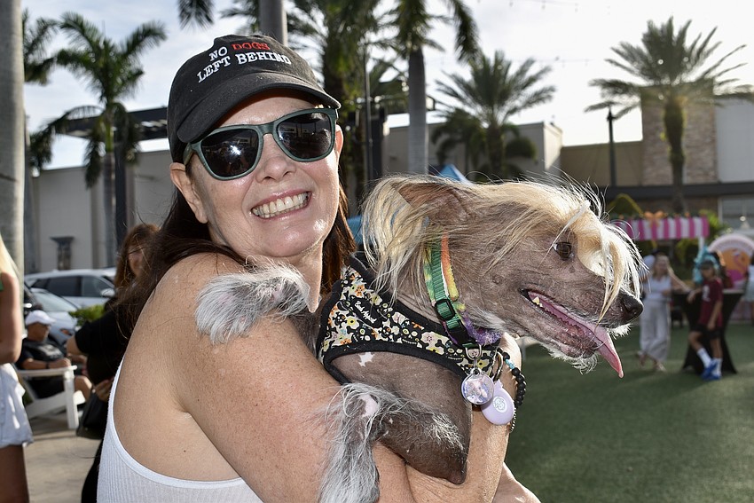 Kathy Zimmer and Raigo, a Chinese crested dog, are new to Sarasota from Fort Lauderdale.