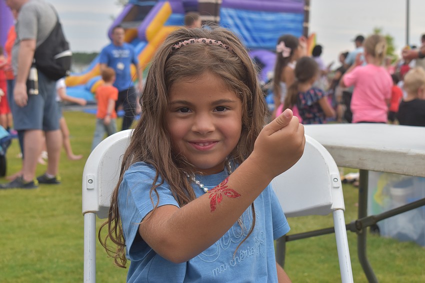 Bradenton resident Luna Zuluaga, 4, says the tattoo from Akiko Graphics makes her feel pretty. She likes glitter and her favorite color is red.