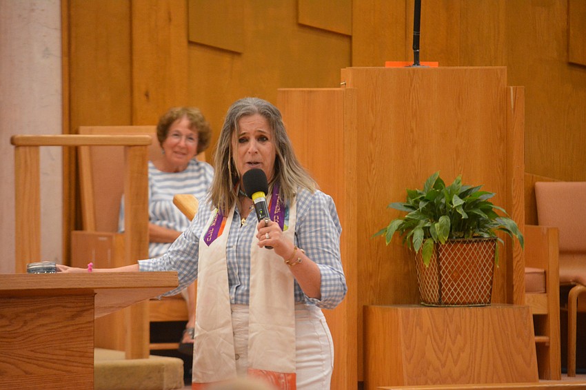 Rabbi Jessica Spitalnic Mates gives a sermon before celebrating the Midsummer Barbecue.