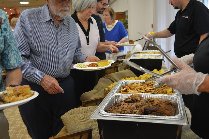 Members of Temple Beth Israel all line up for the Mission BBQ.