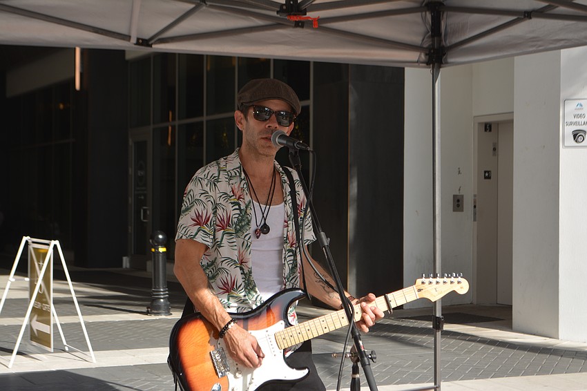 Musician Damon Earlewine brings the tunes and good vibes to the Sarasota Farmers Market.