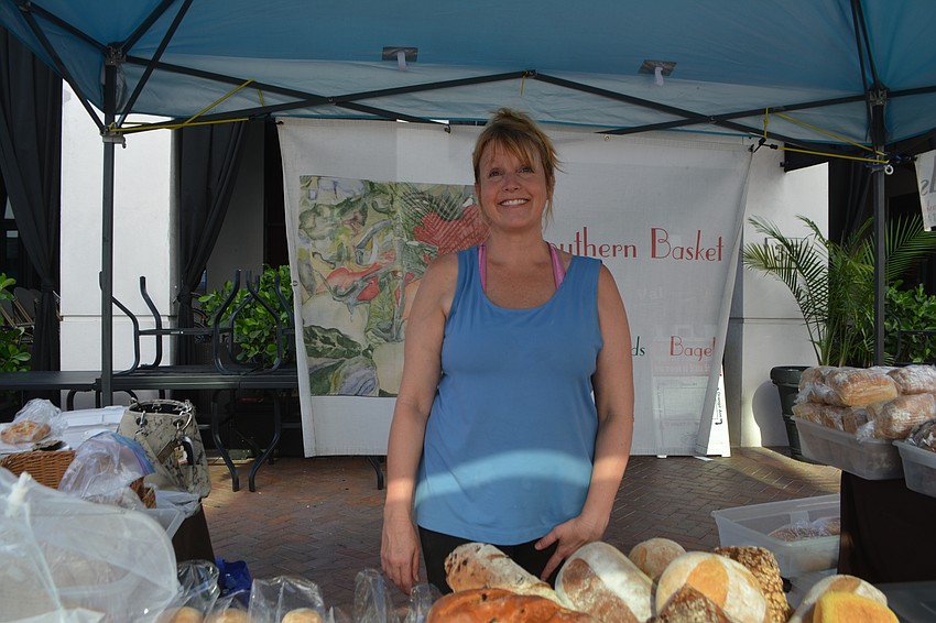Melissa Jeffrey smiles while serving up delicious bread at the Southern Basket booth.