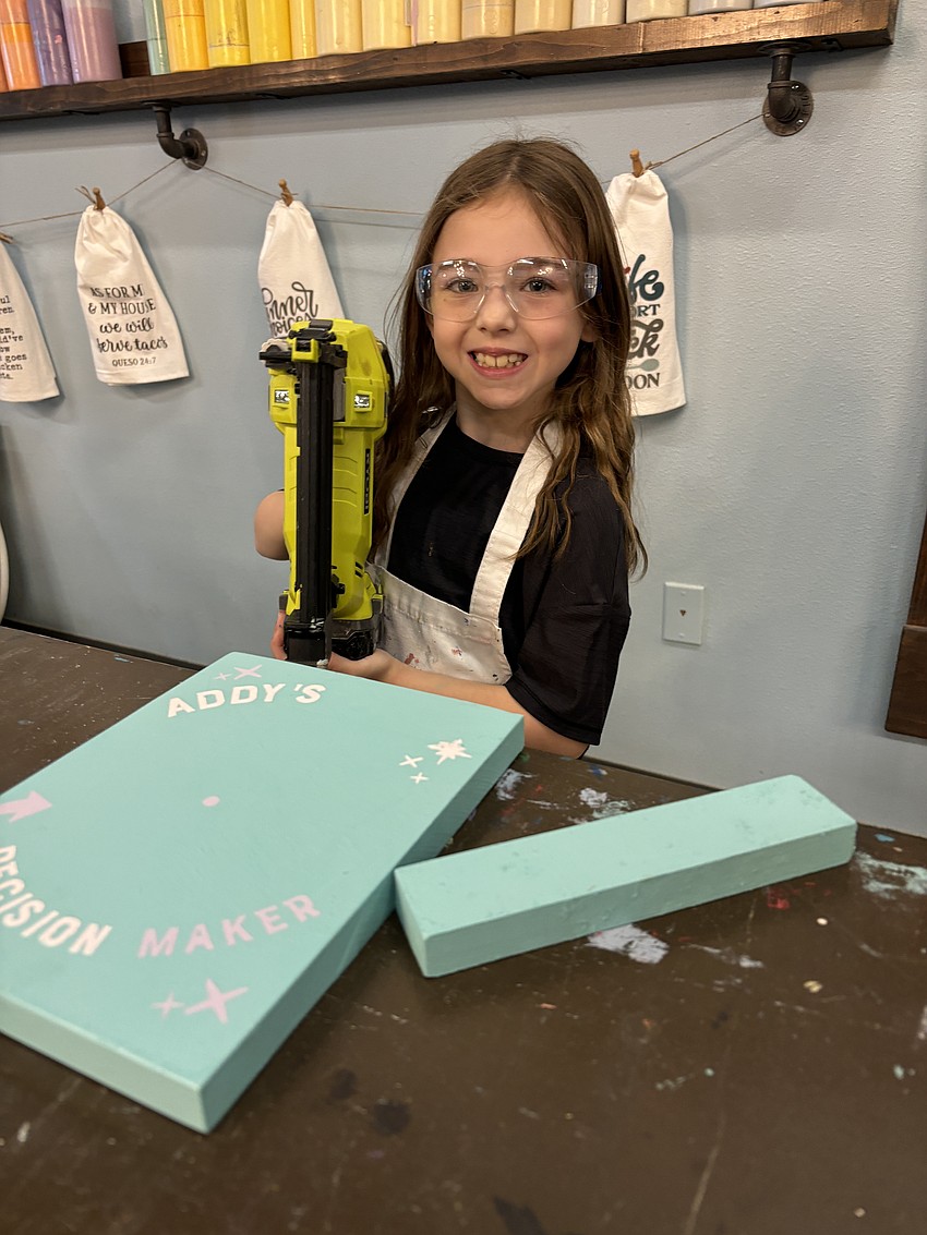 Addison Kibel, 9, works on a project during this year's summer camp.