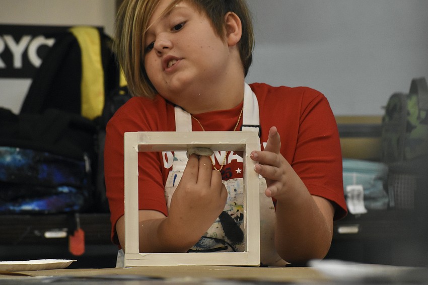 Julian Sieb-Miller, 8, works on his project.