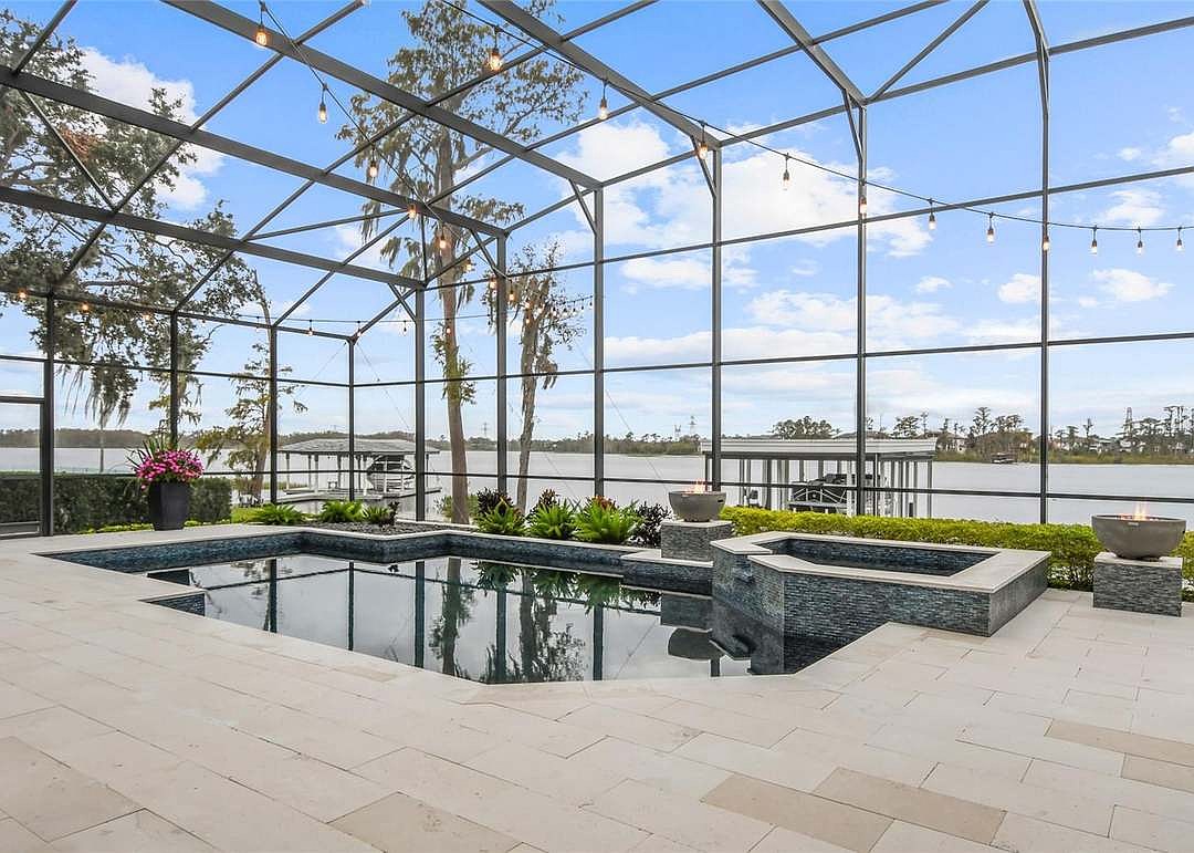 The home at 6009 Lady Bet Drive, Orlando, sold July 10, for $3,564,000. The property features an outdoor living space with 215 feet of water frontage and an unobstructed view of Lake Tibet. The sellers were represented by Ruthanne Martin, Revel Realty LLC.