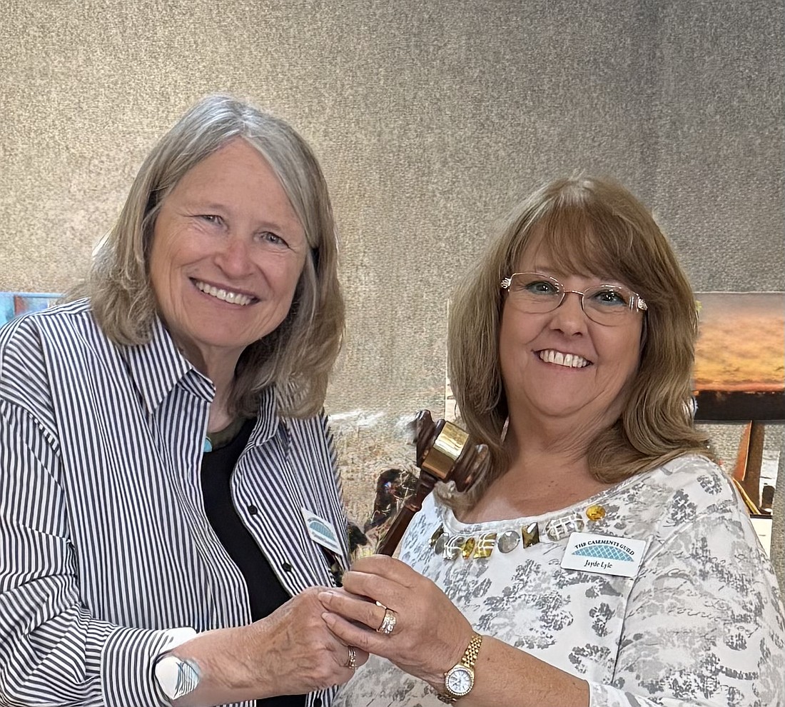 Outgoing President Christine Davenport passes the gavel to the new President Jayde Lyle. Courtesy photo