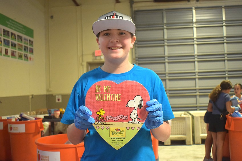Lakewood ranch resident Tristan Norlan, 13, finds a Snoopy inspired Valentine's Day box of chocolate. It expired on June 1, 2022 and chocolate is only good for one year after expiration so it was thrown away.