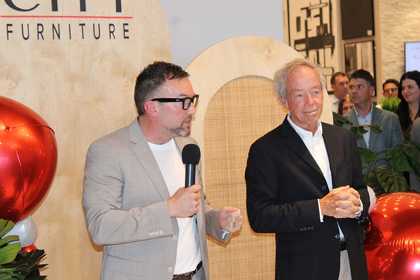 City Furniture CEO Andrew Koenig and his father, company founder Keith Koenig, address the crowd July 17 during grand opening ceremonies.