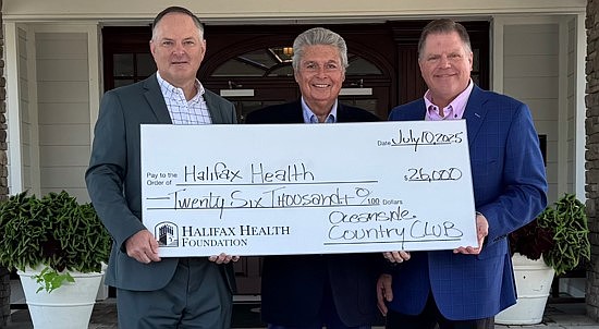 John Guthrie, executive director of the Halifax Health — Foundation; Chuck Grant, chairman of the SALLY; and David Main, general manager of Oceanside Country Club. Courtesy photo