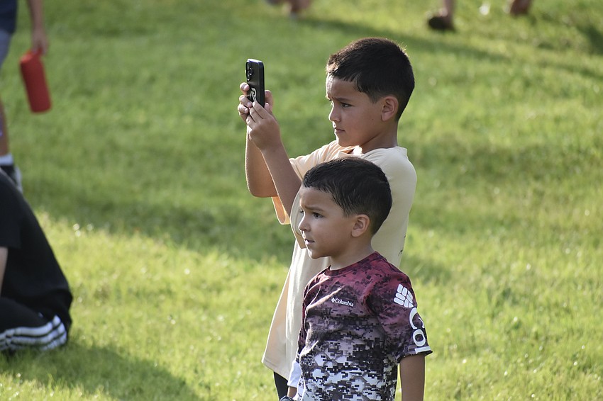 Xander Vieyra, 9, and his brother Remy Vieyra, 4, watch the show.
