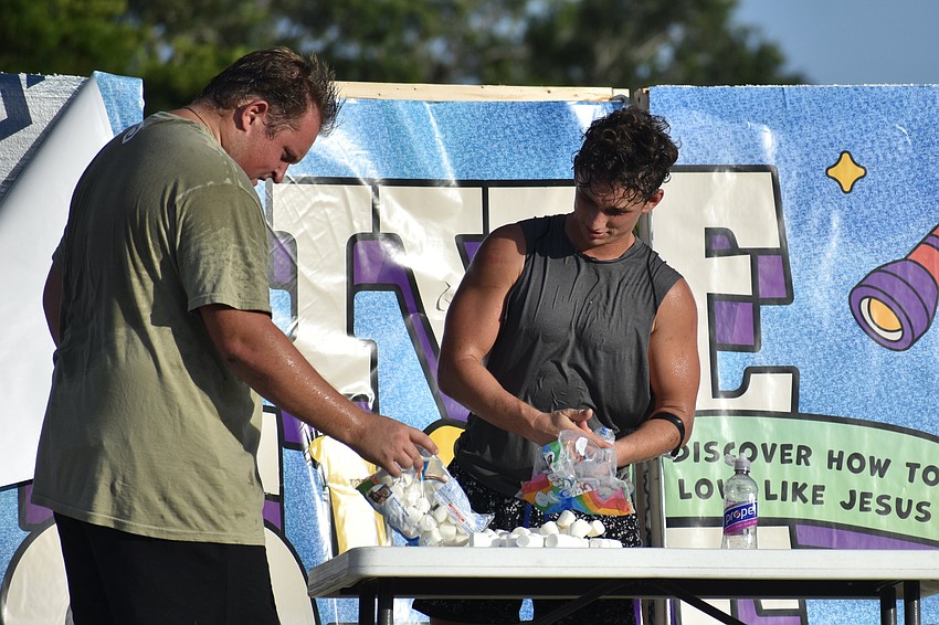 Jake Ajemian and Shayne Boyle set out the marshmallows.