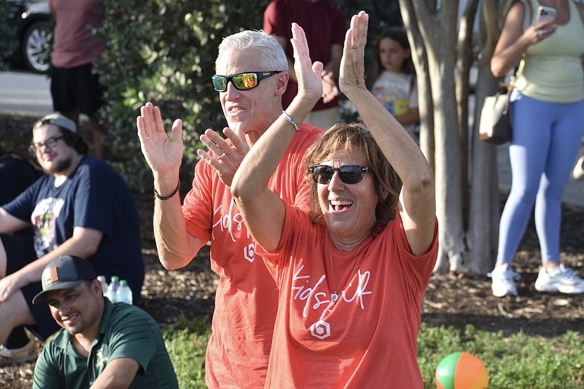 Brad Mason and his wife Debbie Mason applaud Shayne Boyle.