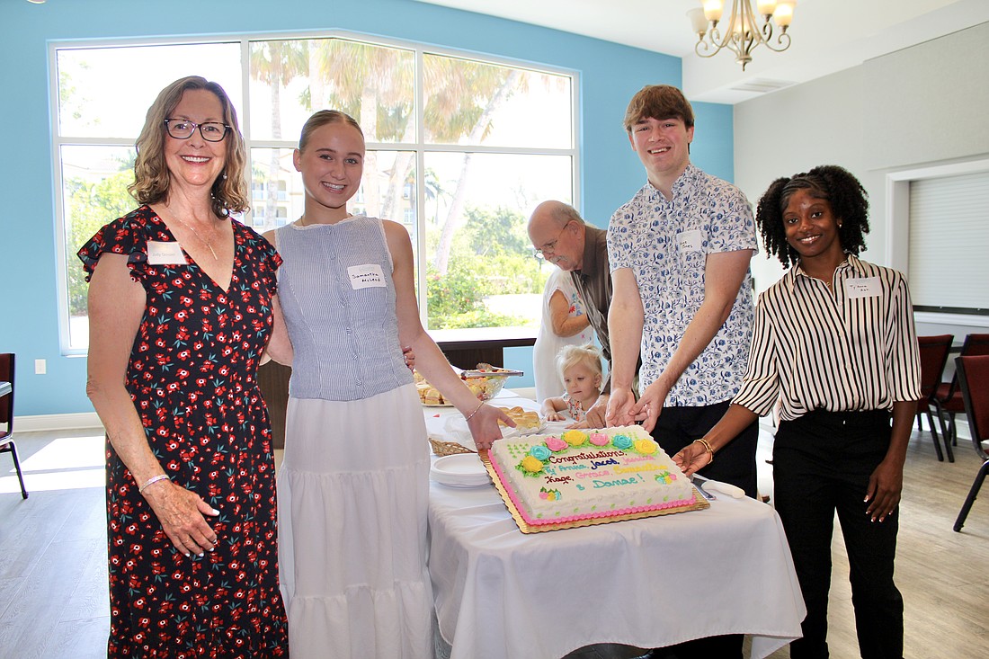 Judy Govalet, a member of Longboat Island Chapel's scholarship committee, joins students Samantha McLead, Kage Jones and Ty'Anna Ash in celebrating this year's awards.
