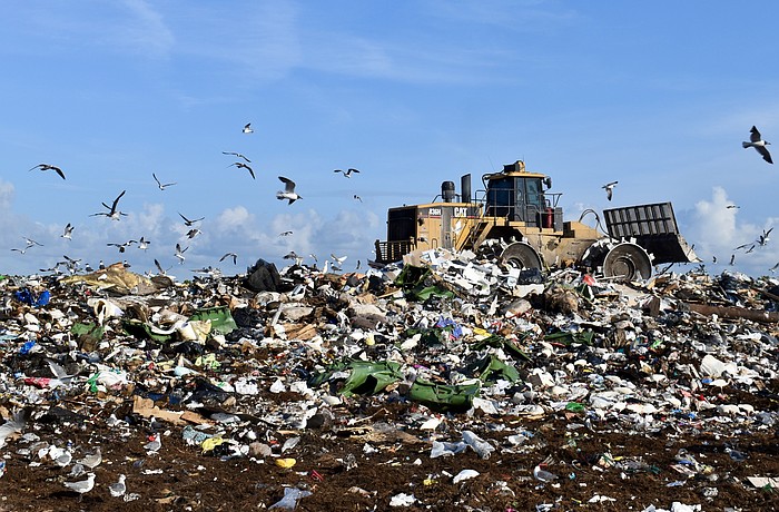 A bulldozer moves trash at the Lena Road Landfill.