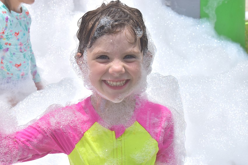 Lakewood Ranch resident Rosemary Combast, 5, emerges from the foam.