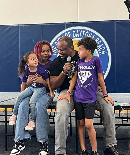 Darius Kelley, founder of the DWALY Foundation, and his children. Courtesy photo