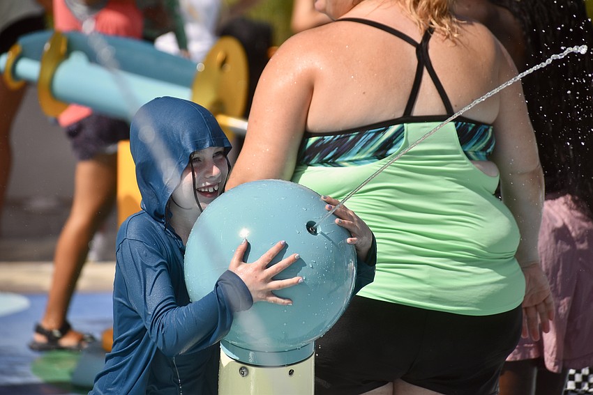 Claire Chase, 7, is a sharp shooter with a water gun. Her 13-year-old brother Carter is enrolled in the Summer Skills Camp.