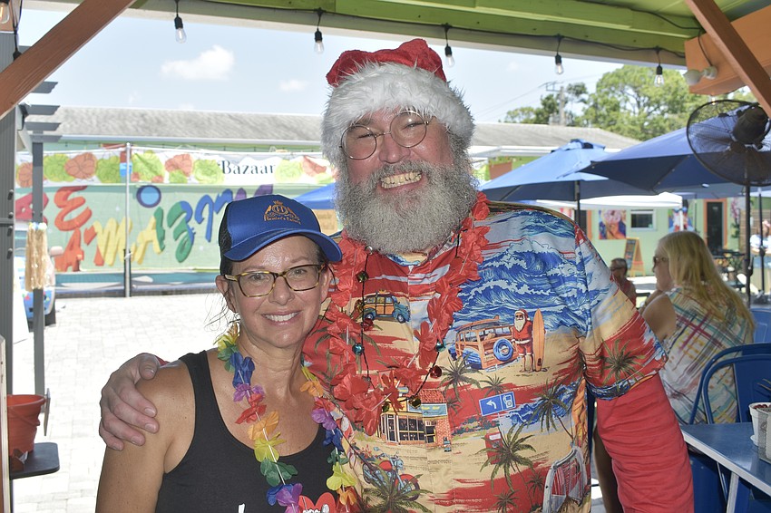 The Bazaar co-owner Kim Livengood and Surfer Santa.