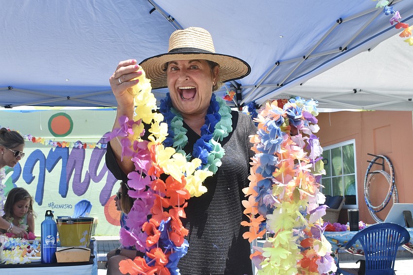 Shelby Davis of Eternal Reefs gathers the flower leis.