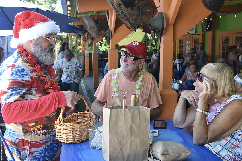 Surfer Santa visits Don and Judy Hanzlik.