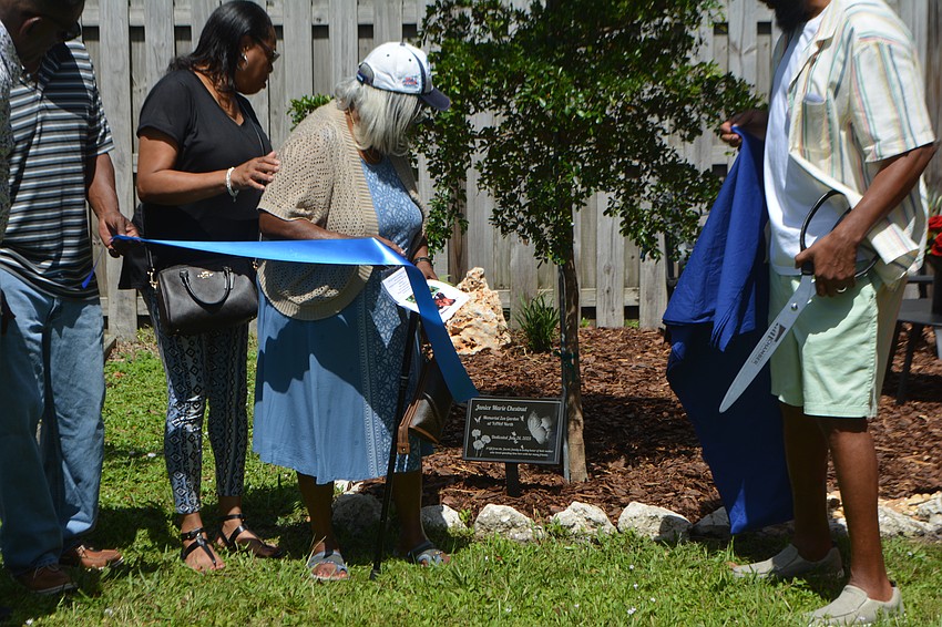 The unveiling of the memorial plaque to honor Janice Marie Chestnut's memory.