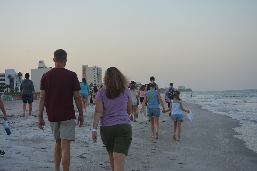 The Turtle Watch group walks to first location bright and early on Saturday morning.