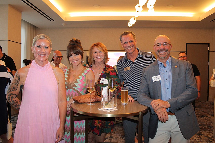 Members of the Longboat Key business community enjoyed an evening of connecting on July 23 at the St. Regis Longboat Key Resort. From left, Lisa Matile, Jen Braden, Julie Wilson, Charlie Murphy and Chris Fehr.