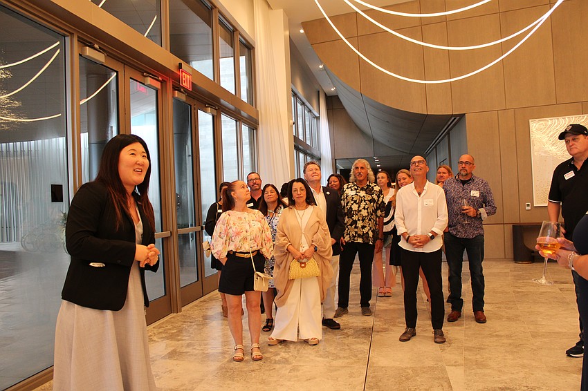 While giving a tour of the St. Regis Longboat Key Resort, Jennifer Chou describes how the strings of lights and oval-shaped conference hall are subtle design nods to the history of the Ringling Circus.