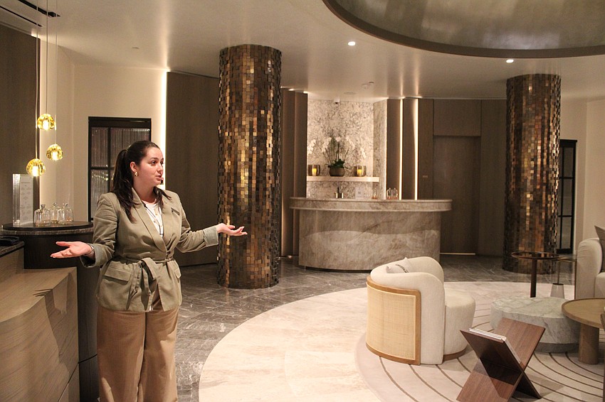 Shannon Friel, spa specialist at the St. Regis Longboat Key Resort, tells tour attendees about the services the spa offers.