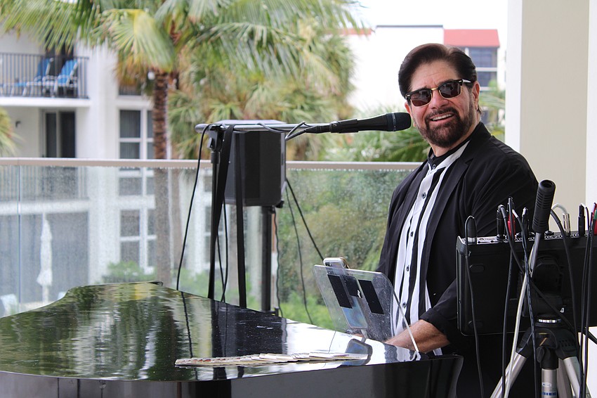 Musician Tim Michael McCaig serenaded guests at the Longboat Key Chamber of Commerce's Off the Clock networking event on July 23 at the St. Regis Longboat Key Resort.