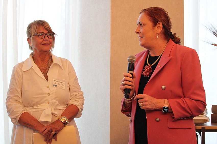Lorna Kirwan, director of sales and marketing at the St. Regis Longboat Key Resort, shares a few words with attendees at the Longboat Key Chamber of Commerce's Off the Clock networking event on July 23 at the resort. Chamber events coordinator Ellen Thomas, left, detailed several events coming up in August.