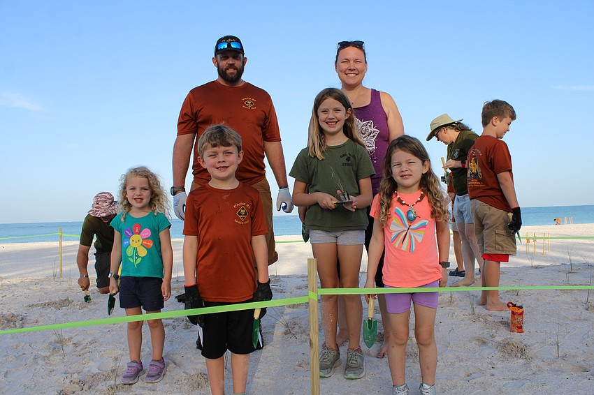 (Front row) Alanna, Logan, Astrid, Eowyn, (back row) Joshua and Diane Hyland brought the whole family out to help with the sea oat planting on Coquina Beach. Diane said they came as part of the Scouts lending a hand, but she was also glad her children could gain a greater appreciation for protecting the beaches.