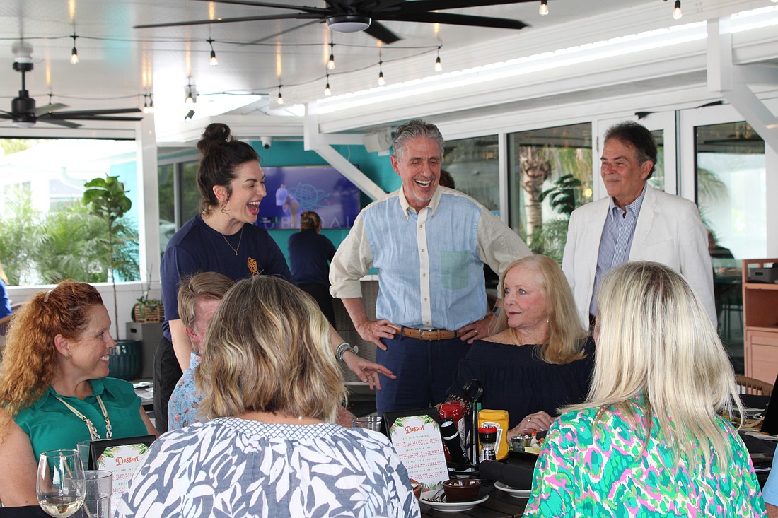 Courtney Rossler, general manager of Lo' Key Island Grille, shares a laugh with Kiwanis Club of Longboat Key president and Lazy Lobster owner Michael Garey at the club's July social hour.