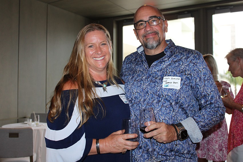 Marilyn Moss and Tom Schlund from The Groovy Room join in networking at the St. Regis Longboat Key Resort.